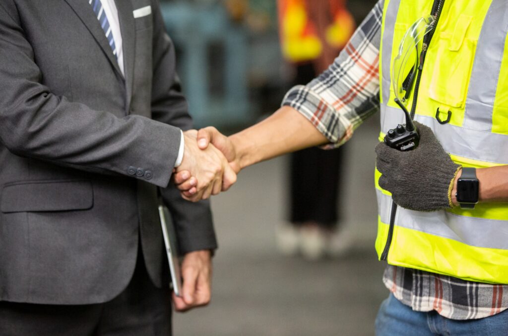 close-up on businessman and engineer with hand shake